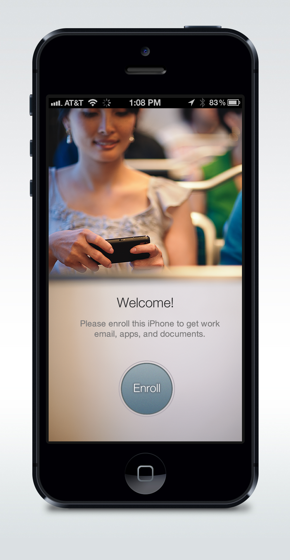 The shipped iOS welcome screen with a photograph, the text Please enroll this iPhone and a round Enroll button