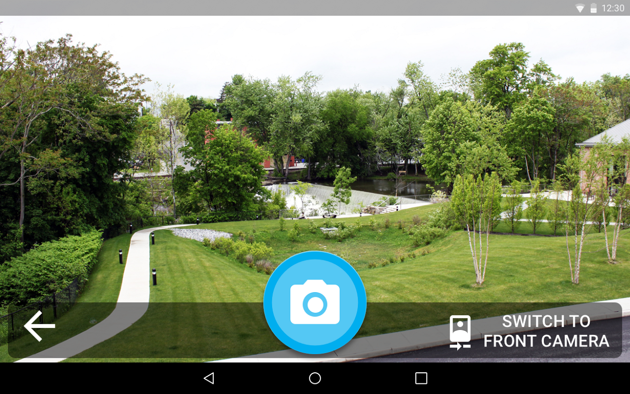 The rear camera view with a camera button and a switch to front camera option